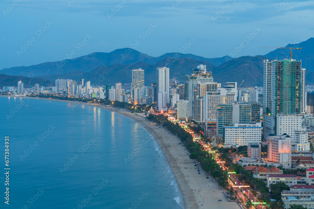 Nha Trang city with buildings and beach view during twilight. Nha Trang city with buildings and beach view during twilight.