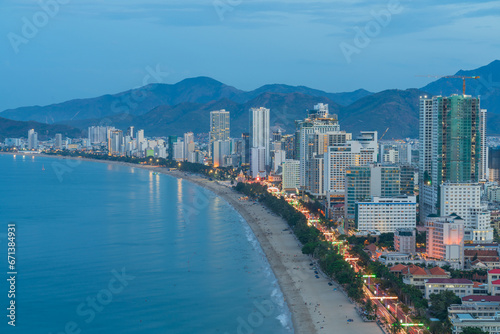 Nha Trang city with buildings and beach view during twilight. © Hanoi Photography