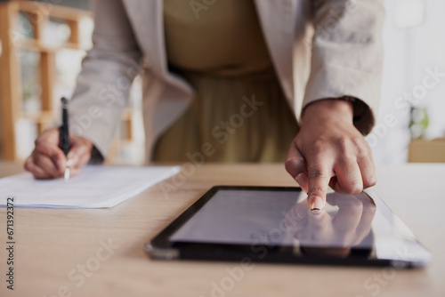 Hand, tablet and fingerprint with a business woman in her office to access a secure database of information. Technology, password or biometrics with a female employee working on documents at her desk
