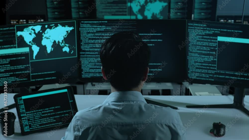 Back View Of Asian Man Developer Working With Tablet While Write Code With Multiple Computer Screens In The Office
Back View Of Asian Man Developer Working With Tablet While Write Code With Multiple Computer Screens In The Office