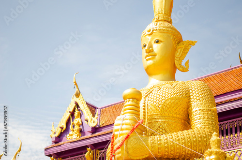 Golden Thao Wessuwan or Vasavana giant statue at Bang Chak Temple, Nonthaburi Province photo