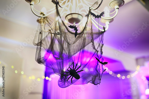 Lampa w sali balowej z pająkiem . Halloween.   photo