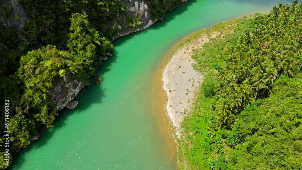 Flying over Daywan River near the municipality of Claver in Surigao Del Norte in the Philippines, aerial Flying over Daywan River near the municipality of Claver in Surigao Del Norte in the Philippines, aerial