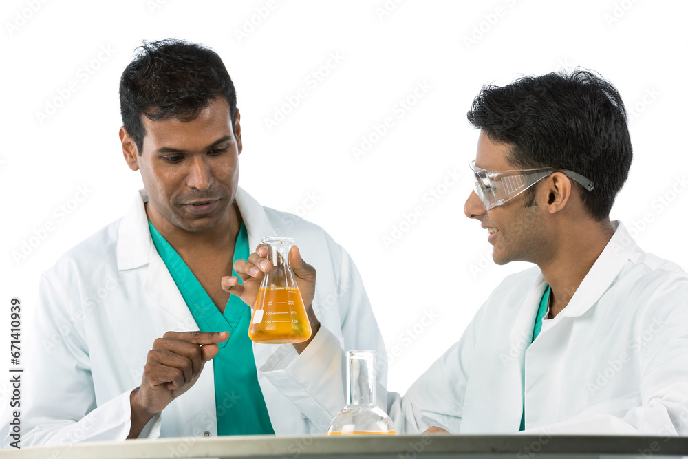 science profesor and student analyzing solution. science profesor and student analyzing solution.