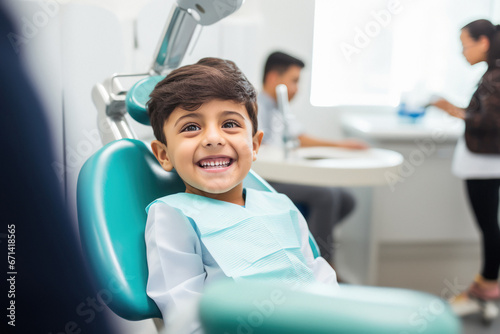 Little boy giving smile while dentist check up photo