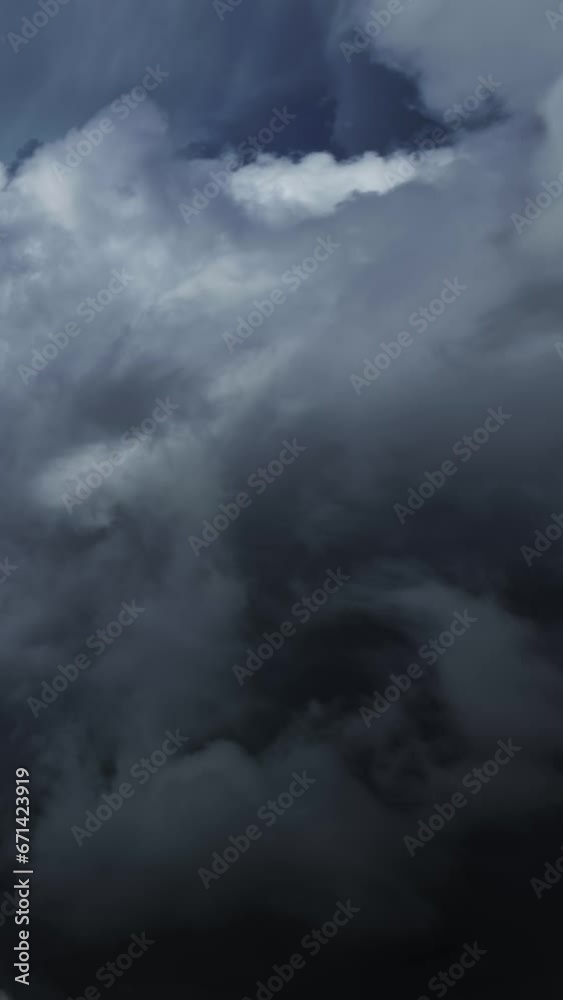 Dramatic dark storm clouds are moving fast. Vertical video Dramatic dark storm clouds are moving fast. Vertical video