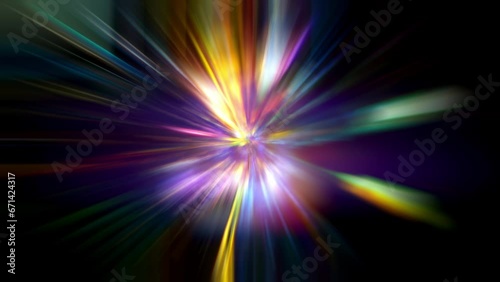 A bunch of multicolored neon rays rotates on a dark background