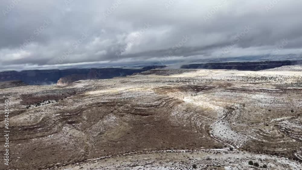 Flying with a helicopter through the western part of the Grand Canyon of the Colorado on a snowy day, between the border of Arizona and Nevada in the United States of America. Flying with a helicopter through the western part of the Grand Canyon of the Colorado on a snowy day, between the border of Arizona and Nevada in the United States of America.