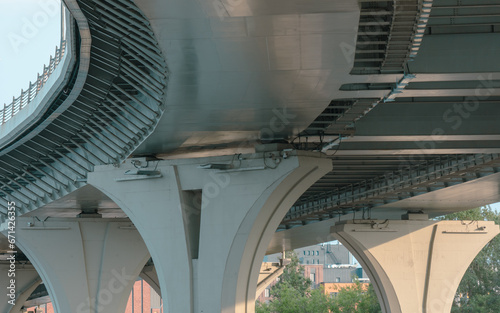 Concrete pillars of a large bridge. Bottom view