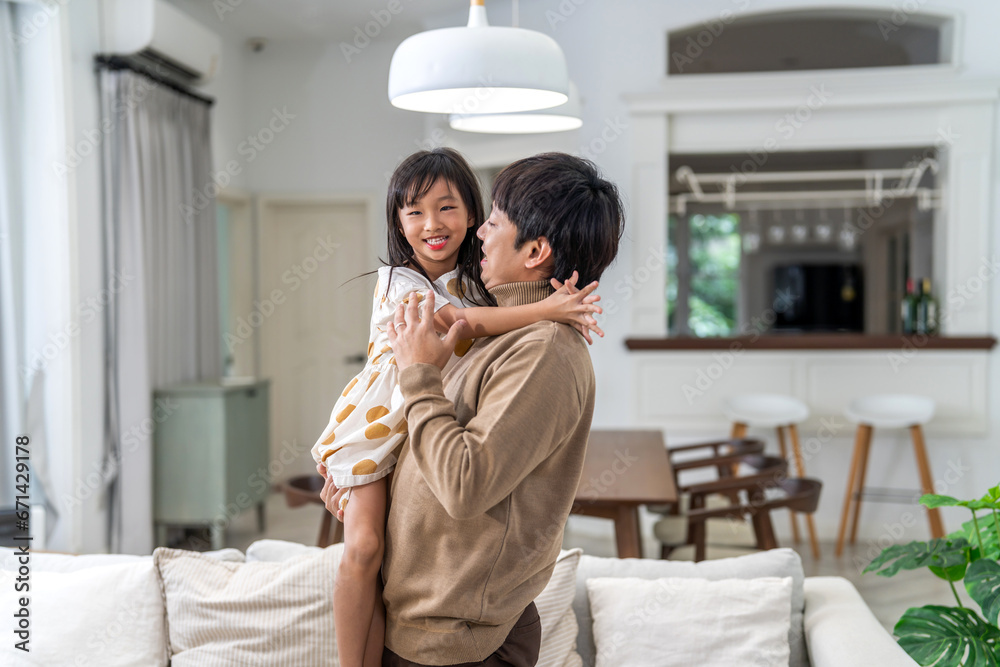 Portrait of enjoy happy love asian family mature father and little girl daughter smiling play laughing and having fun together.happy family and father's Day in moments good time at home Portrait of enjoy happy love asian family mature father and little girl daughter smiling play laughing and having fun together.happy family and father's Day in moments good time at home