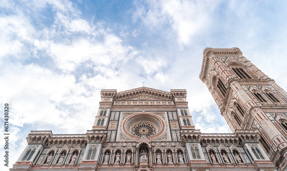 Florence, Italy. View of magnificent facade of Santa Maria del Fiore with sculptures and Giotto's Campanile.