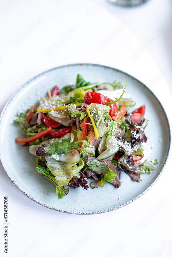 salad with vegetables on a white background salad with vegetables on a white background