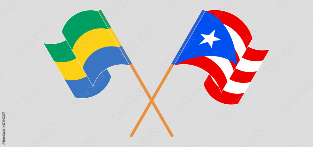 Crossed and waving flags of Gabon and Puerto Rico