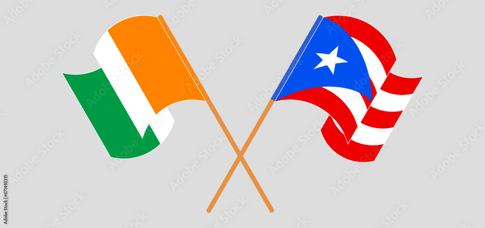Crossed and waving flags of Ivory Coast and Puerto Rico