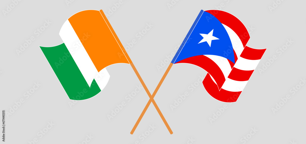 Crossed and waving flags of Ivory Coast and Puerto Rico Crossed and waving flags of Ivory Coast and Puerto Rico