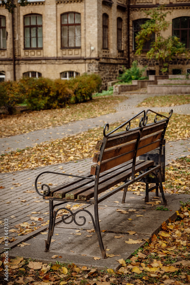 rustic wooden bench. autumn background. Cozy place in the city rustic wooden bench. autumn background. Cozy place in the city