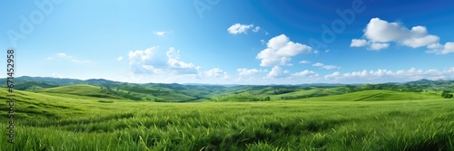 A wide-format background image for creative content  representing the essence of spring with an open green field under a sky adorned with fluffy clouds. Photorealistic illustration