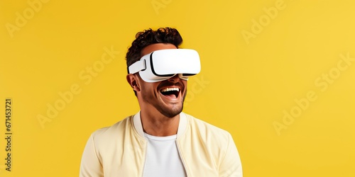 Portrait of happy man wearing virtual reality glasses isolated on yellow background with copy space. Banner template of smiling man with VR goggle photo