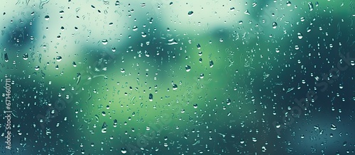 Raindrops on a dirty glass window with city scenery and a detailed texture