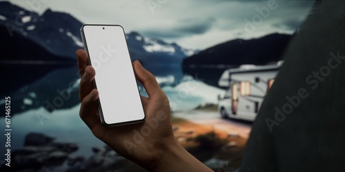 CU Caucasian male using his phone near the RV in the evening. Phone mockup