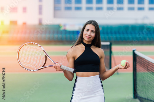 Beautiful stylish sexy woman in trendy sportswear on tennis court. © Ivan Zelenin