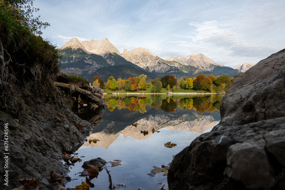 Fototapeta premium Amazing autumn photography in the austrian mountains with a reflecting lake.