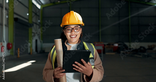 Architect, tablet or factory woman, happy engineer and smile for construction design, maintenance or engineering illustration. Architecture industry, PPE or person reading warehouse renovation review © N Felix/peopleimages.com