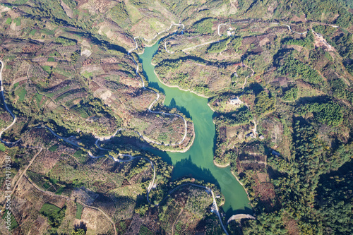 Drone view of reservoir and dam, high angle view of beautiful green water and hills at Ningbo, Zhejiang province, China.