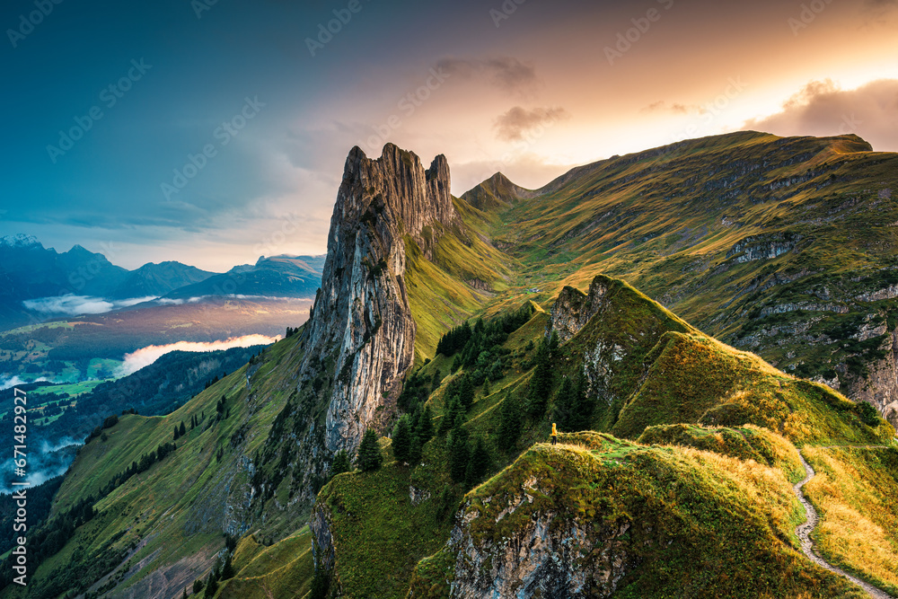 Sunset over majestic rocky mountain ridge of Saxer Lucke, Swiss Alps in autumn at Switzerland Sunset over majestic rocky mountain ridge of Saxer Lucke, Swiss Alps in autumn at Switzerland