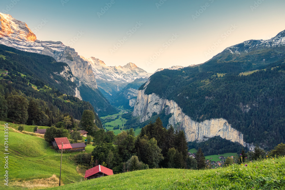 Fototapeta premium Wengen village and Lauterbrunnen valley with Jungfrau mountain in the evening at Bern, Switzerland