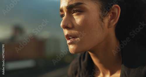 Woman, athlete and thinking outdoor for fitness, exercise or wellness with determination or thoughtful. Runner, person and mindfulness for workout, training and healthy body with sportswear in town