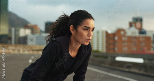Woman, athlete or breathe outdoor for fitness, exercise or wellness and city background or nature. Runner, person or tired or break for workout, training and healthy body with sportswear in town road