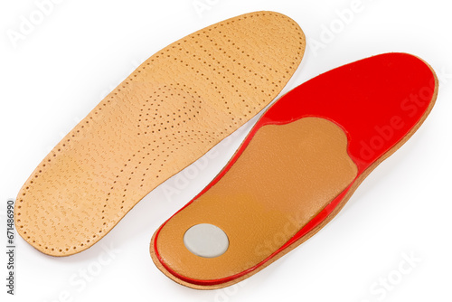 Orthopedic shock absorber insoles with perforated leather coating