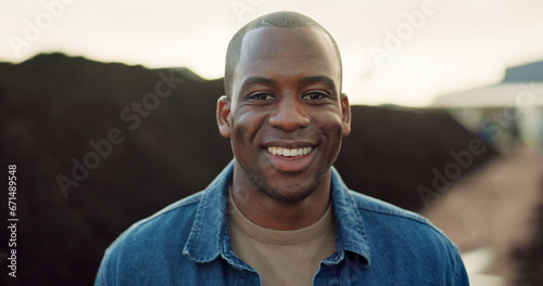 Happy, portrait and black man outdoor on farm, land and eco friendly agriculture with greenhouse in Nigeria. African, farmer and smile for work in sustainability, farming and happiness in countryside © N Felix/peopleimages.com