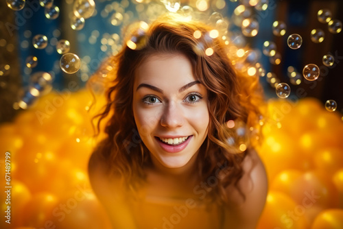 Beautiful woman's face surrounded by orange bubbles.