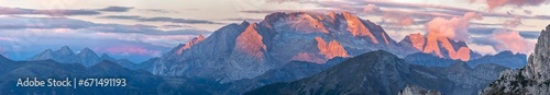 View of pink mountain peaks at sunrise from Falzarego pass, South Tyrol, Dolomites, Italy photo