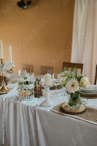 Flower decoration for celebrations. Decoration of tables and chairs. Rustic decoration.