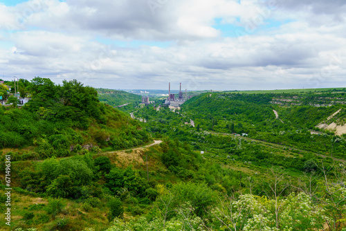 Plant or factory. Industrial area in a picturesque beautiful green area. Background with selective focus and copy space