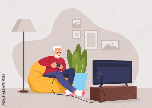 grandpa sits on a comfortable armchair and plays video games