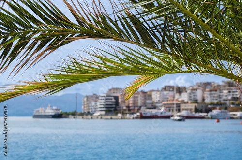 Beautiful landscape of Saranda. Albania City Port. The Ionian Sea. Albanian Riviera. Blue sea and palm trees. © Elena_Alex
