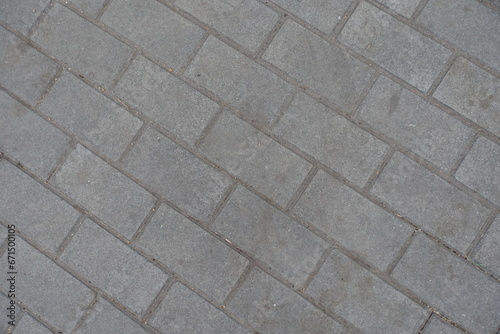 Texture of running bond brick like gray concrete pavement