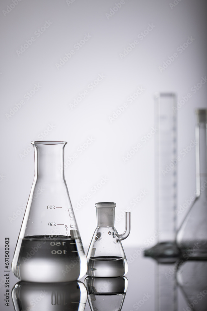 Vertical image of close up of laboratory dishes and copy space on grey background