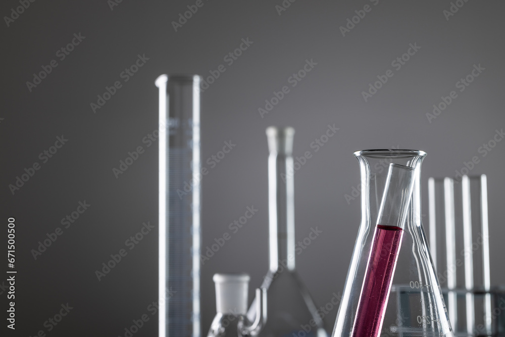 Close up of laboratory dishes and copy space on grey background Close up of laboratory dishes and copy space on grey background