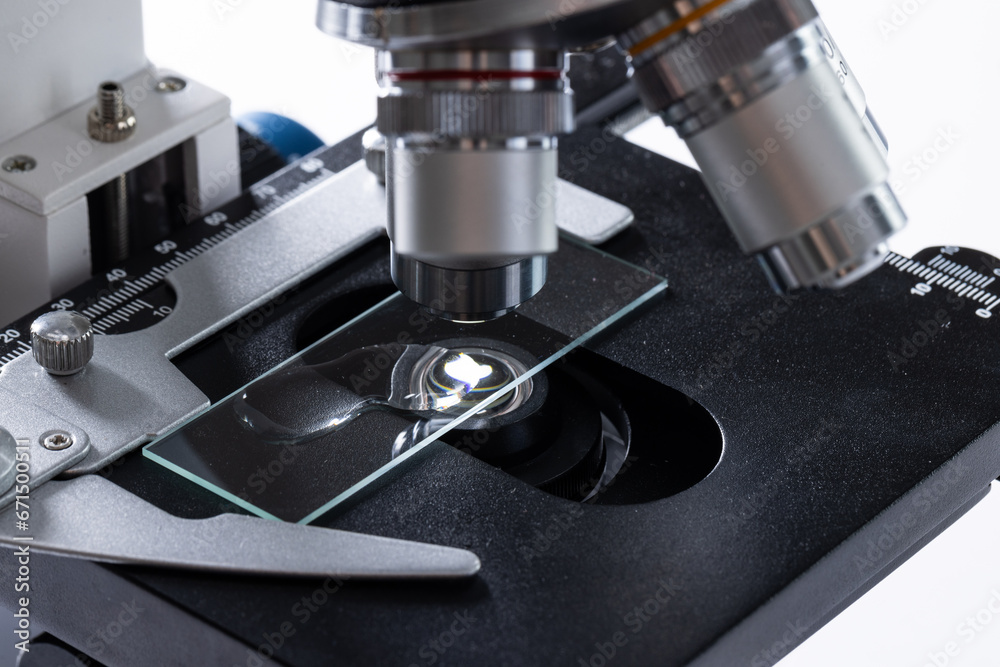 Close up of laboratory microscope and copy space on white background Close up of laboratory microscope and copy space on white background