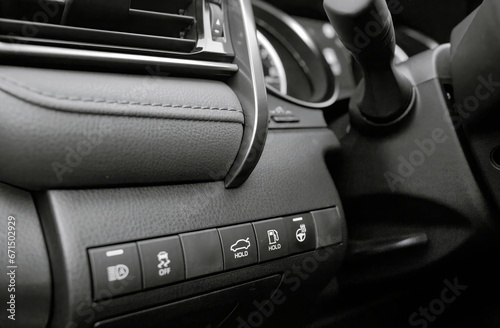 Car buttons on a control panel background  car elements close view