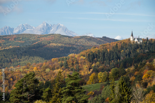 Basilica of the Visitation of the Virgin Mary on top of the Marianska hill, peaks of High Tatras in background, Slovakia photo