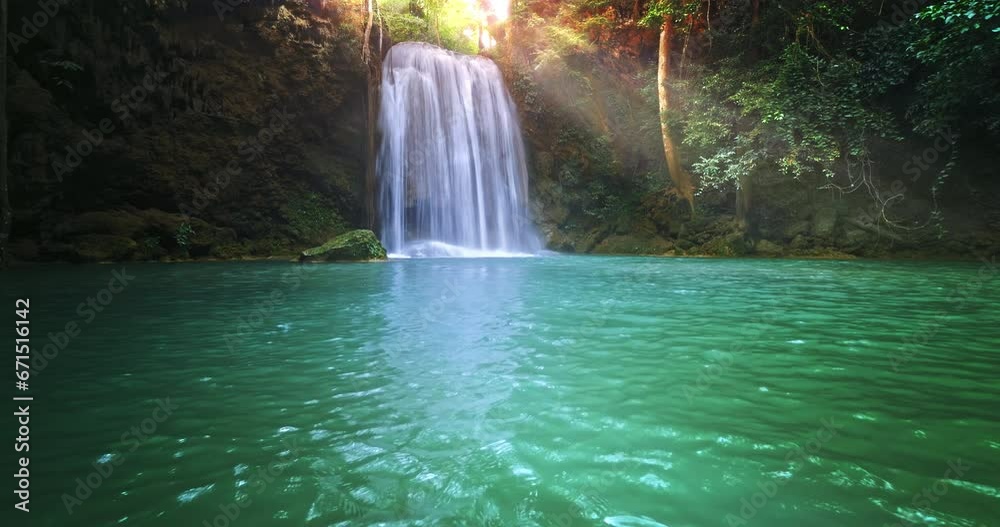 Nature paradise. Heaven waterfall with emerald lake in wild forest Nature paradise. Heaven waterfall with emerald lake in wild forest