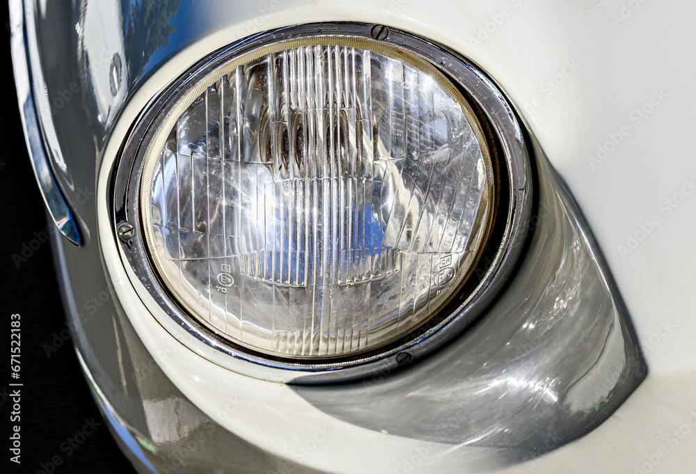 Detail of the headlights of an old car, classic, retro vehicle