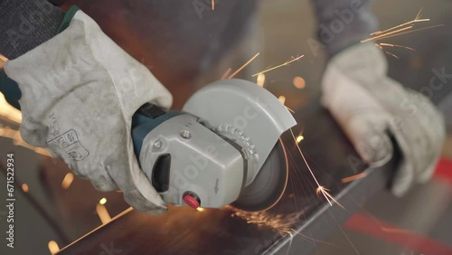 Skilled Worker Using a Grinder for Metal Cutting in Dynamic Poses and Angles, Ready for Action in the Advanced Metallurgical Industry in 4K Quality