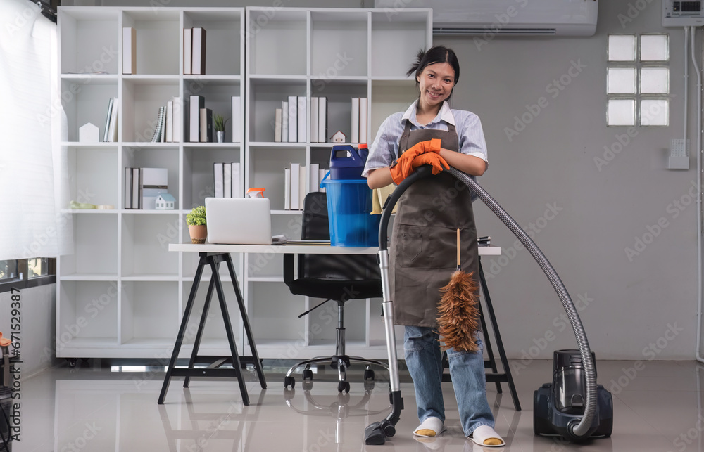 Cleaning in the office Beautiful cleaning lady uses a mop and a vacuum cleaner to clean the floor and get rid of dust. Cleaning concept Housekeeping Cleaning in the office Beautiful cleaning lady uses a mop and a vacuum cleaner to clean the floor and get rid of dust. Cleaning concept Housekeeping